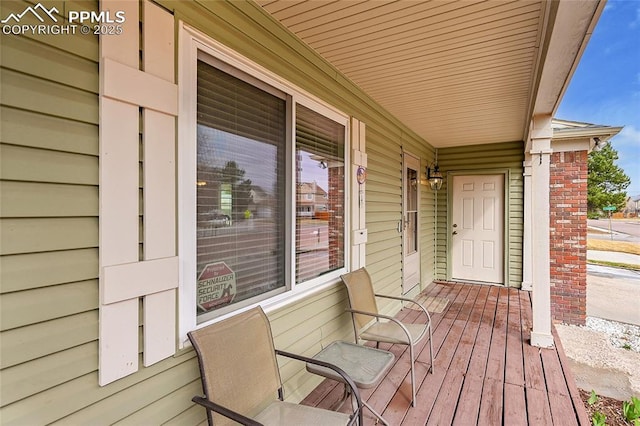 wooden deck featuring covered porch