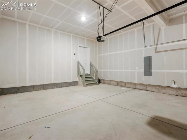 garage featuring electric panel and a garage door opener
