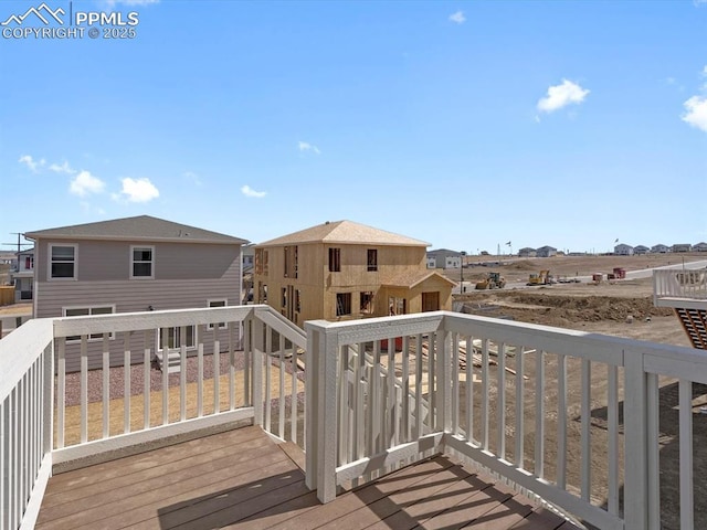 wooden terrace featuring a residential view