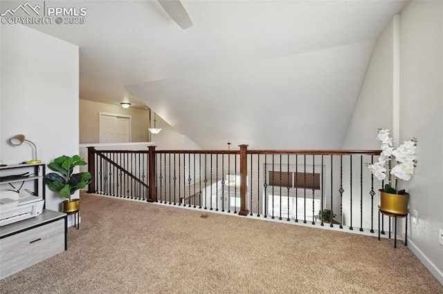 bonus room featuring carpet and vaulted ceiling