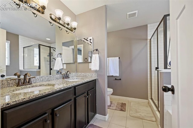 bathroom with tile patterned floors, a sink, visible vents, and a shower stall