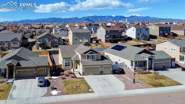 drone / aerial view with a mountain view and a residential view