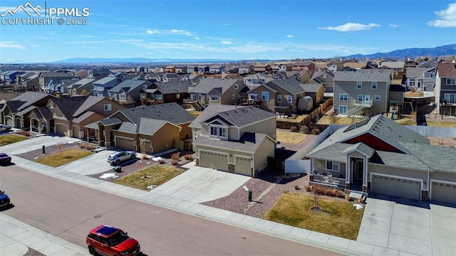 aerial view with a residential view and a mountain view