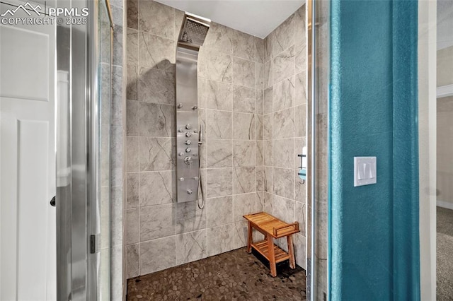 bathroom with tiled shower