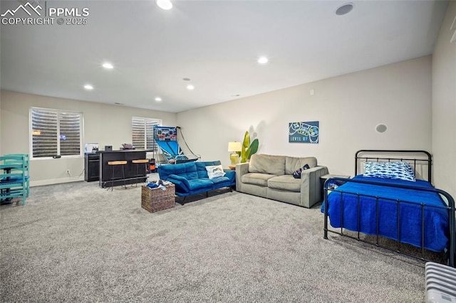 carpeted living room featuring recessed lighting and baseboards