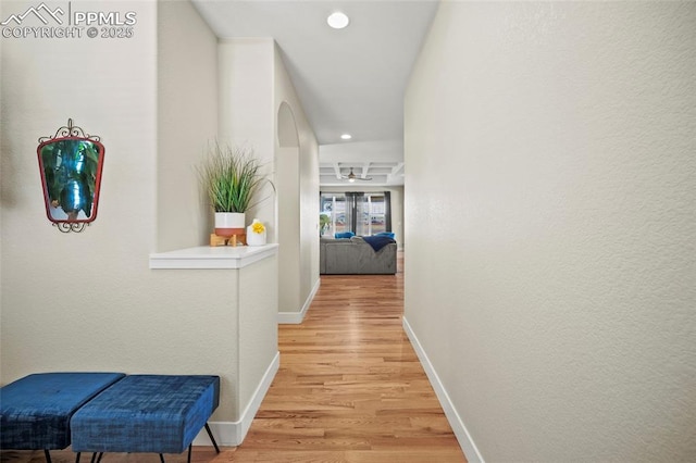 hallway with recessed lighting, baseboards, and light wood finished floors