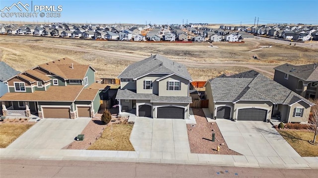 view of front of property with a residential view and driveway