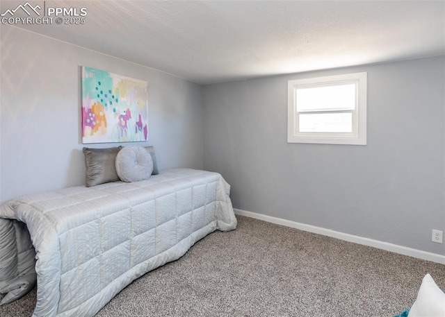 carpeted bedroom with baseboards