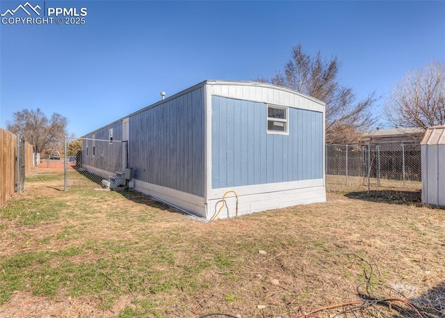 view of outdoor structure featuring an outbuilding and a fenced backyard