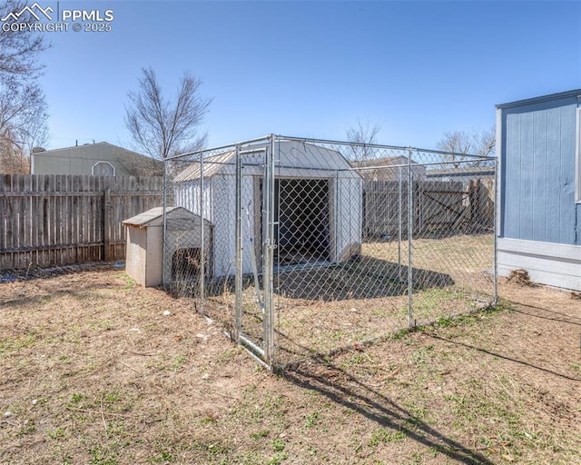 view of yard featuring an outbuilding and a fenced backyard