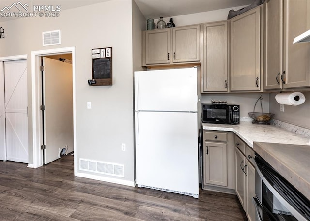 4679 Canyon Wren Ln, Colorado Springs, CO 80916 - kitchen with freestanding refrigerator, black microwave, gray cabinetry, dark wood-style floors, and light countertops