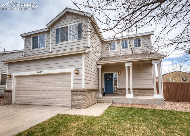 4679 Canyon Wren Ln, Colorado Springs, CO 80916 - traditional-style home with brick siding, fence, a garage, and driveway