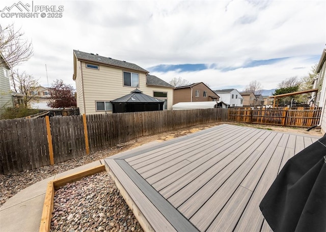 4679 Canyon Wren Ln, Colorado Springs, CO 80916 - wooden deck featuring a fenced backyard, a residential view, and a gazebo