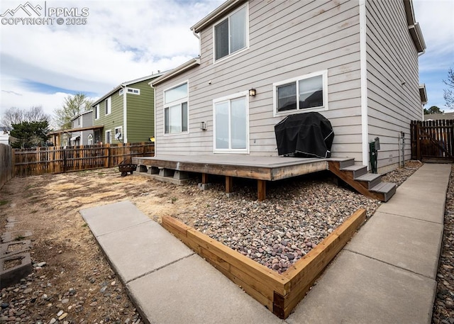 4679 Canyon Wren Ln, Colorado Springs, CO 80916 - back of house with a wooden deck and a fenced backyard