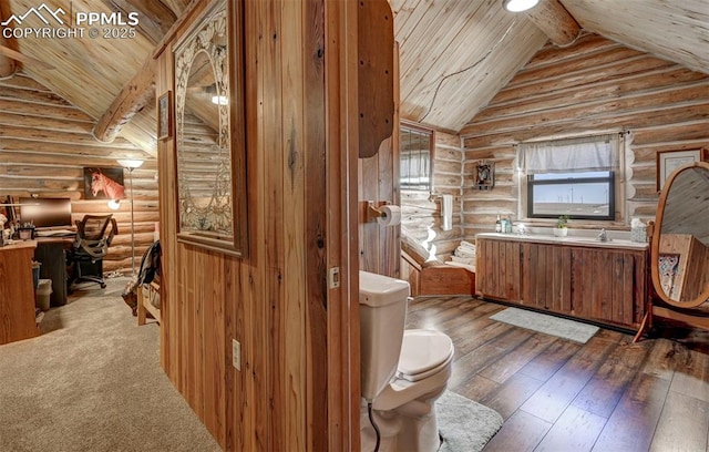 bathroom featuring wooden ceiling, toilet, vanity, beamed ceiling, and wood-type flooring