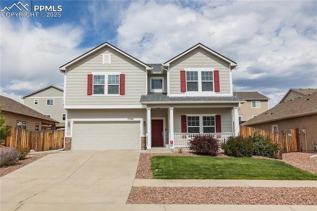 view of front of house featuring a porch, concrete driveway, fence, and a garage