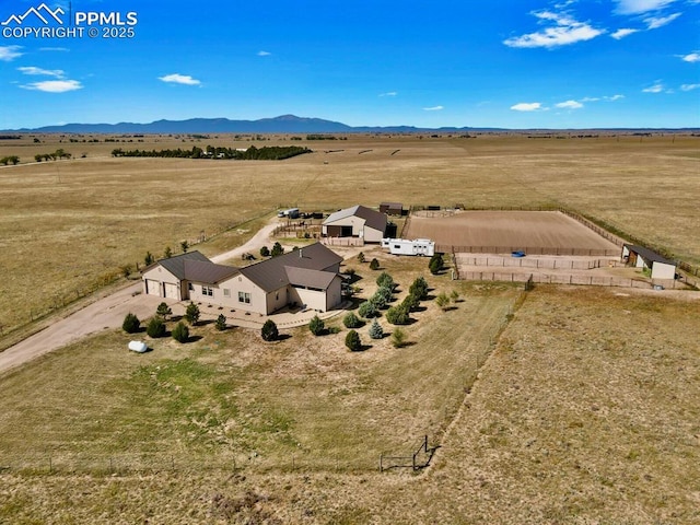 drone / aerial view featuring a rural view and a mountain view