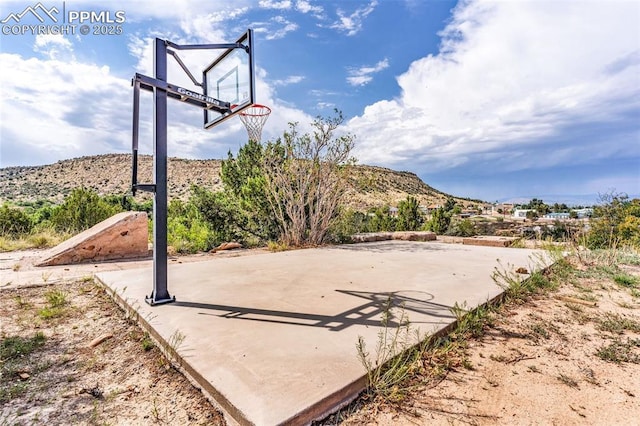 view of basketball court with community basketball court and a mountain view