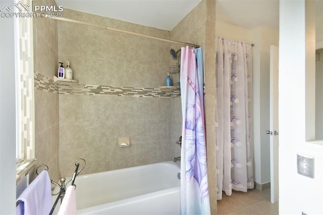 bathroom featuring tile patterned flooring and shower / bathtub combination with curtain