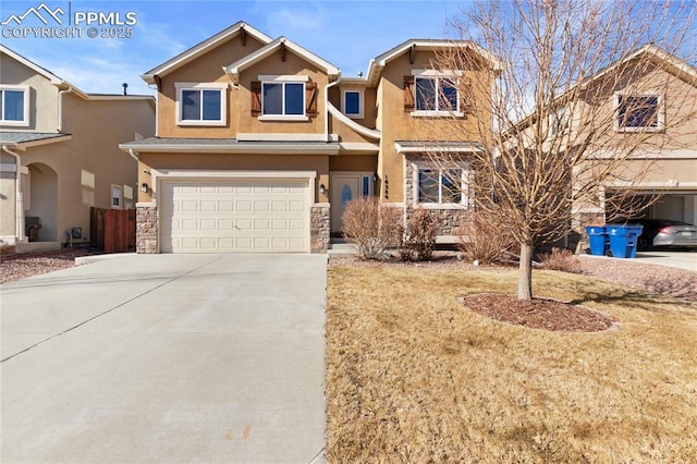 view of front facade featuring concrete driveway, stone siding, an attached garage, and stucco siding