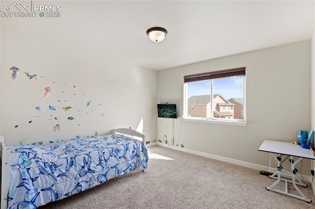 bedroom with carpet flooring and baseboards