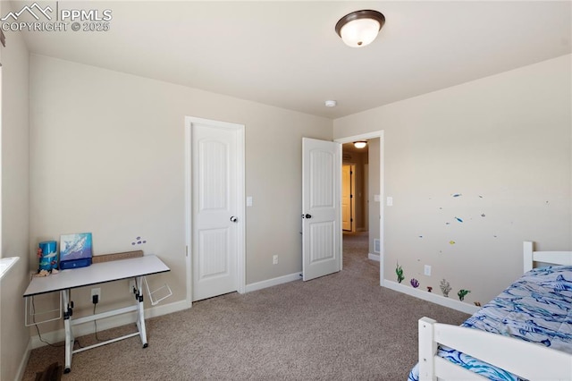 bedroom with carpet and baseboards