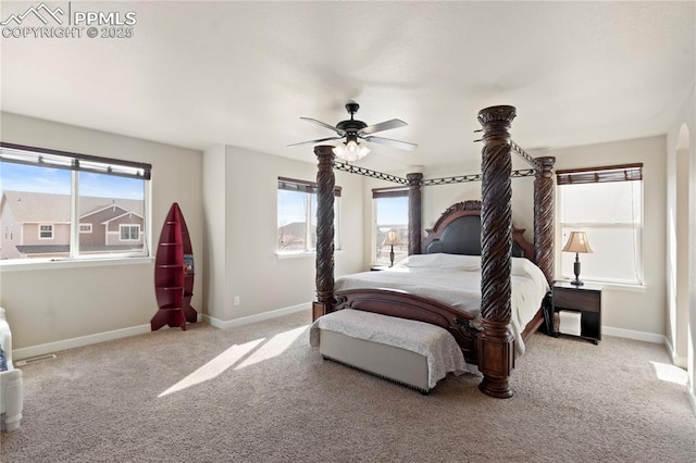 carpeted bedroom with baseboards and a ceiling fan