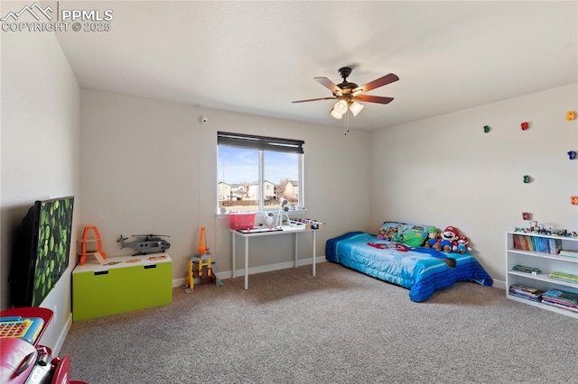 carpeted bedroom featuring baseboards and a ceiling fan