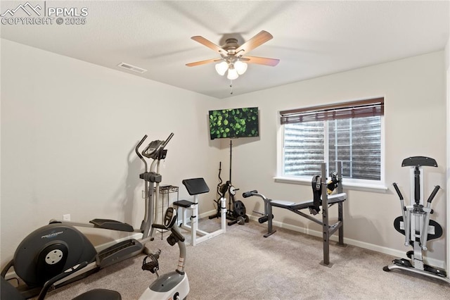 exercise area featuring ceiling fan, carpet flooring, visible vents, and baseboards