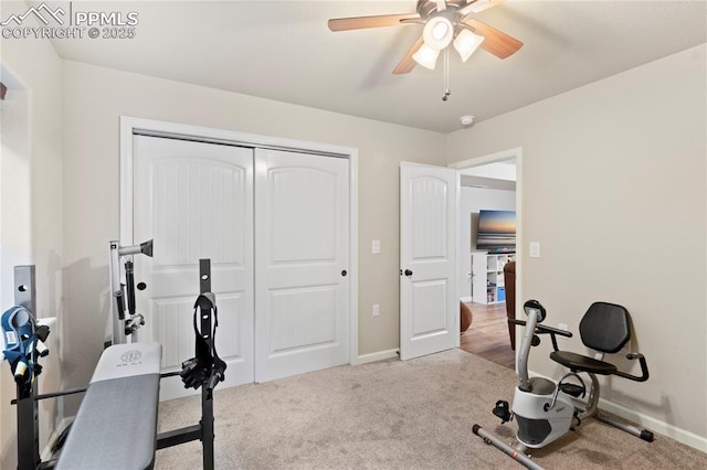 exercise room featuring carpet floors, ceiling fan, and baseboards