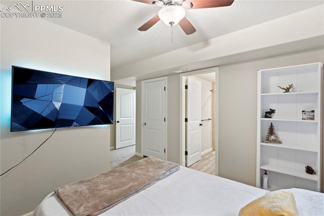 bedroom featuring ensuite bath and ceiling fan