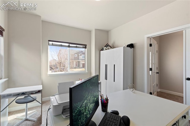 office featuring baseboards and carpet flooring