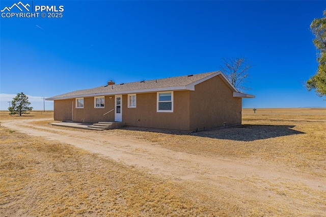 view of front of home featuring entry steps and stucco siding