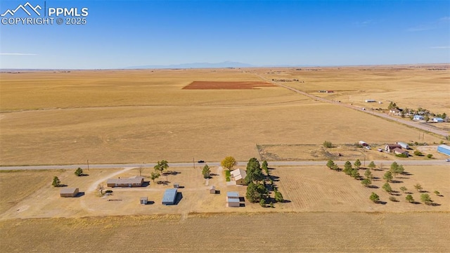 drone / aerial view with view of desert and a rural view