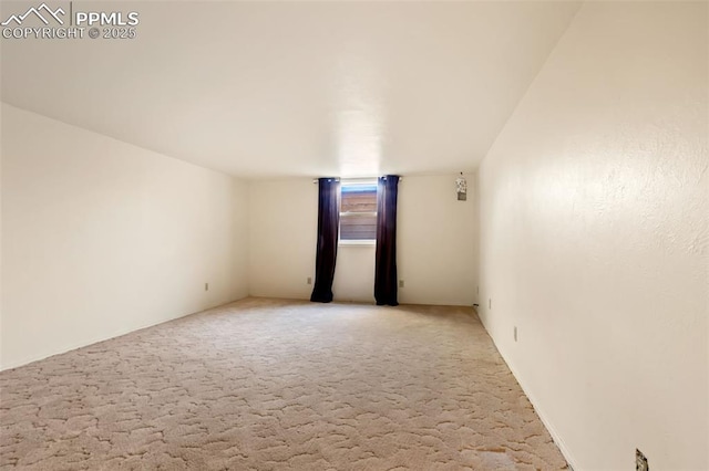 empty room featuring light colored carpet