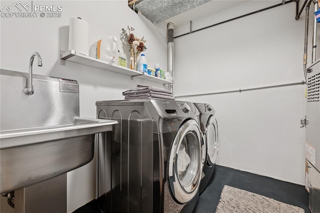 washroom featuring laundry area and washing machine and dryer