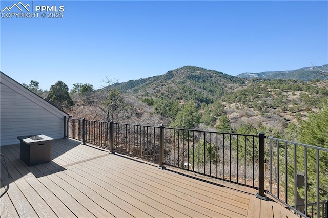 wooden terrace with a mountain view