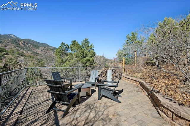 view of patio / terrace featuring a mountain view