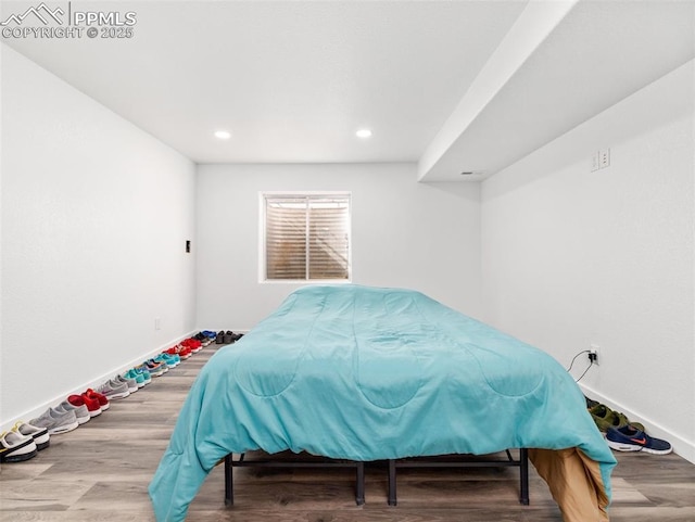 bedroom featuring recessed lighting, baseboards, and wood finished floors