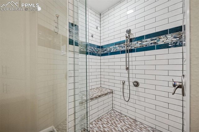 bathroom featuring a stall shower