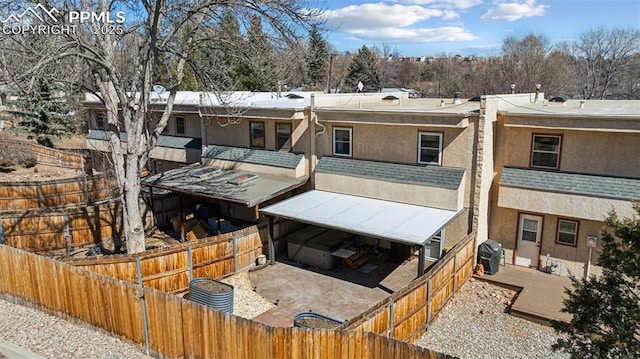 view of building exterior featuring fence