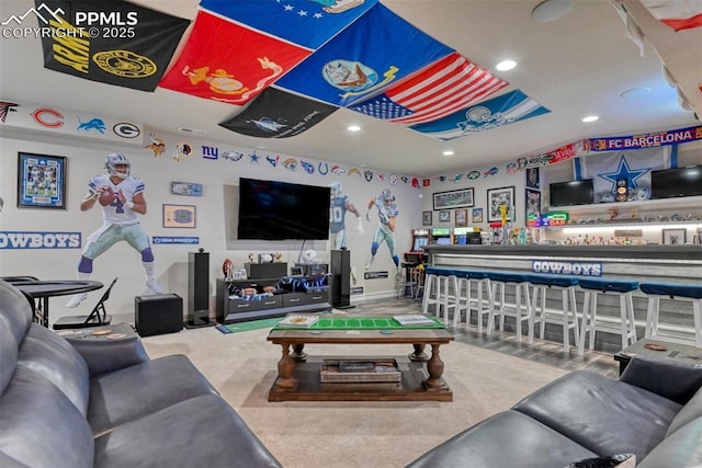 living area with recessed lighting and baseboards