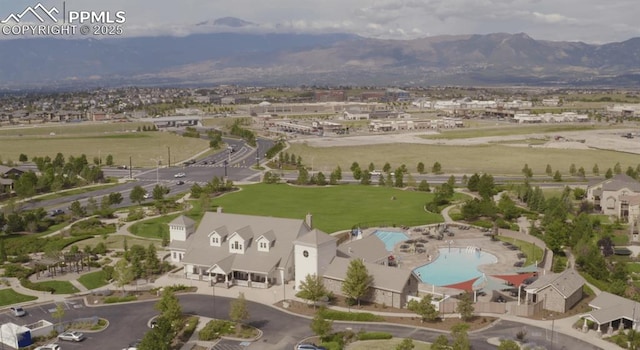 drone / aerial view featuring a residential view and a mountain view