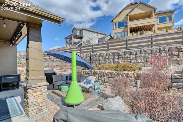 view of patio featuring fence and outdoor lounge area