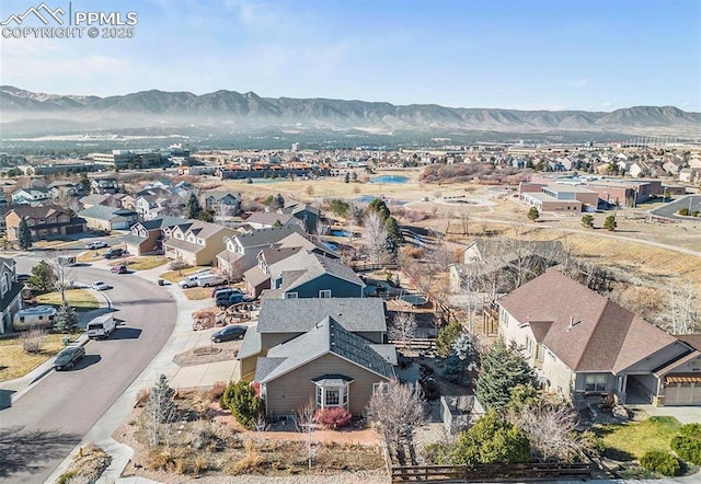 drone / aerial view with a residential view and a mountain view