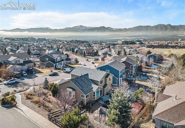 birds eye view of property with a residential view and a mountain view