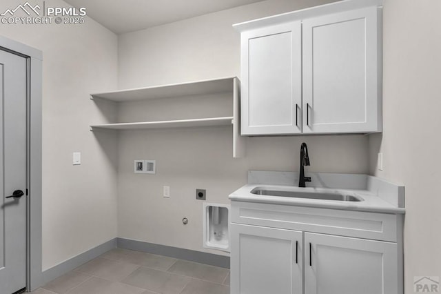 laundry area featuring washer hookup, hookup for a gas dryer, cabinet space, a sink, and electric dryer hookup