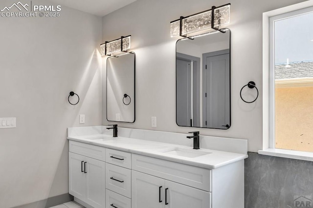 bathroom with a sink and double vanity