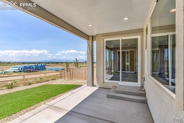 view of patio / terrace featuring fence