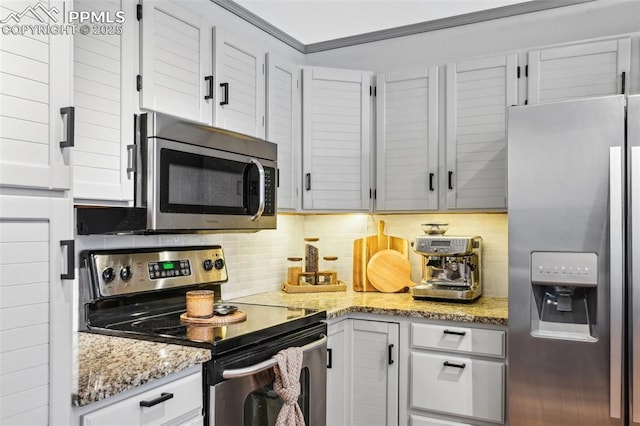 kitchen featuring crown molding, stainless steel appliances, light stone countertops, and decorative backsplash